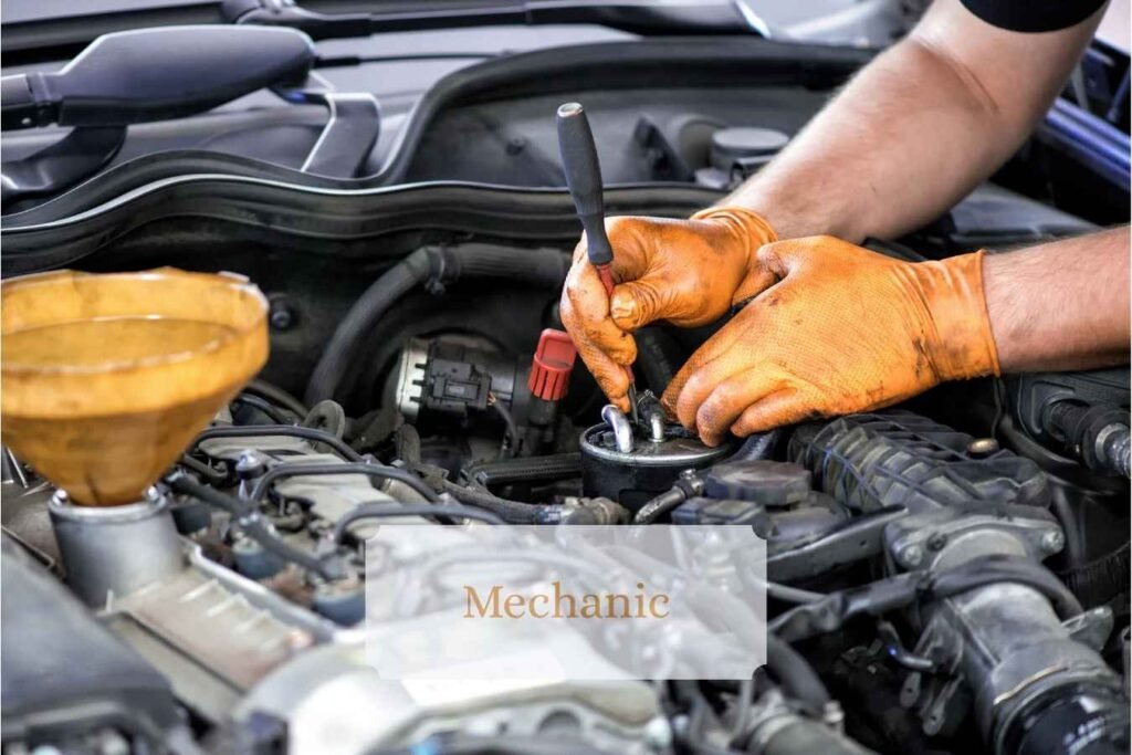 A mechanic working on a vehicle in a workshop